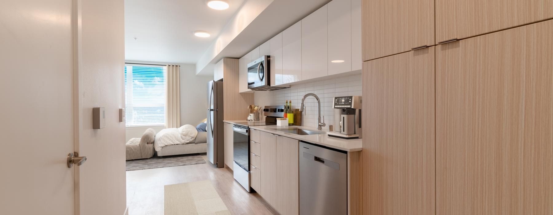 a kitchen with wooden cabinets