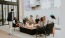 a group of young adults conversing