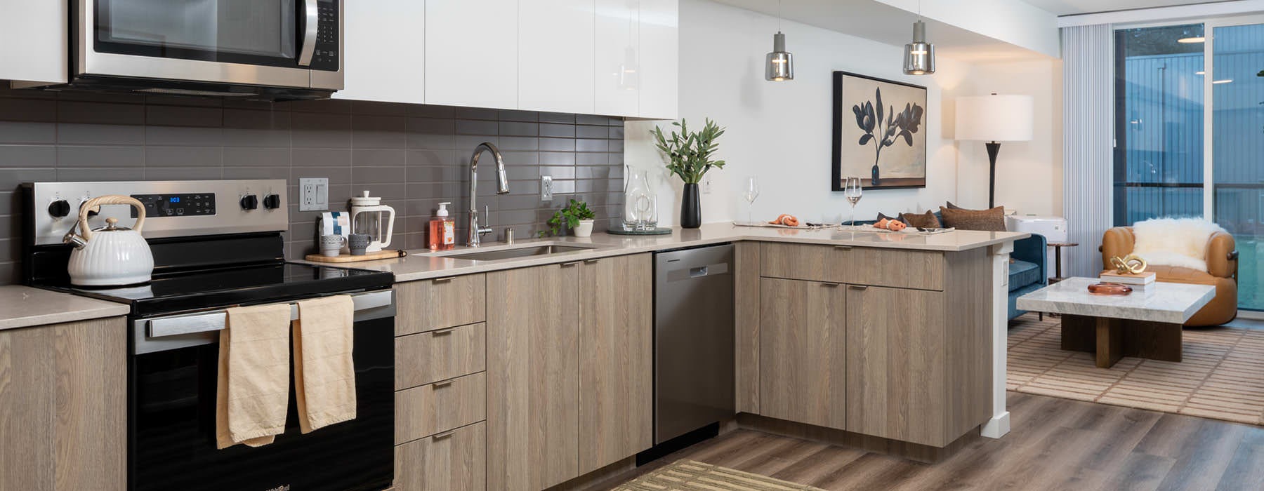 kitchen with ample lighting open to living room