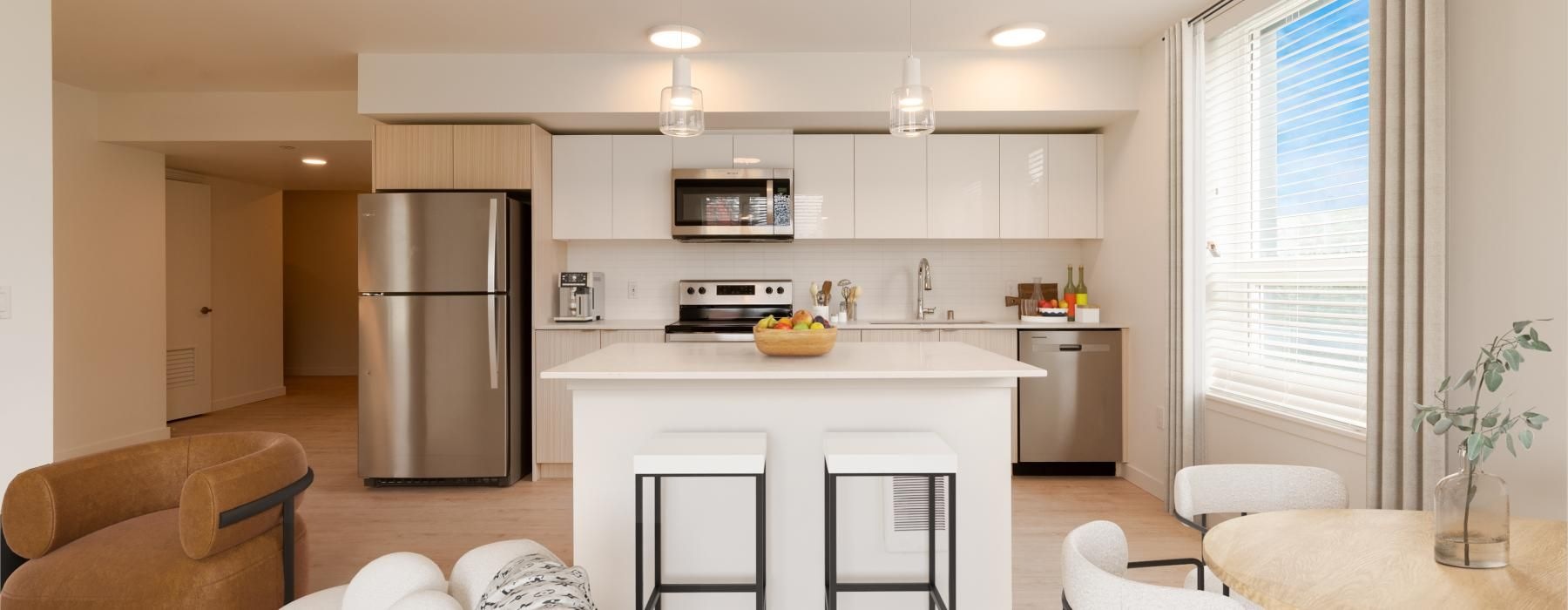 a kitchen with a table and chairs