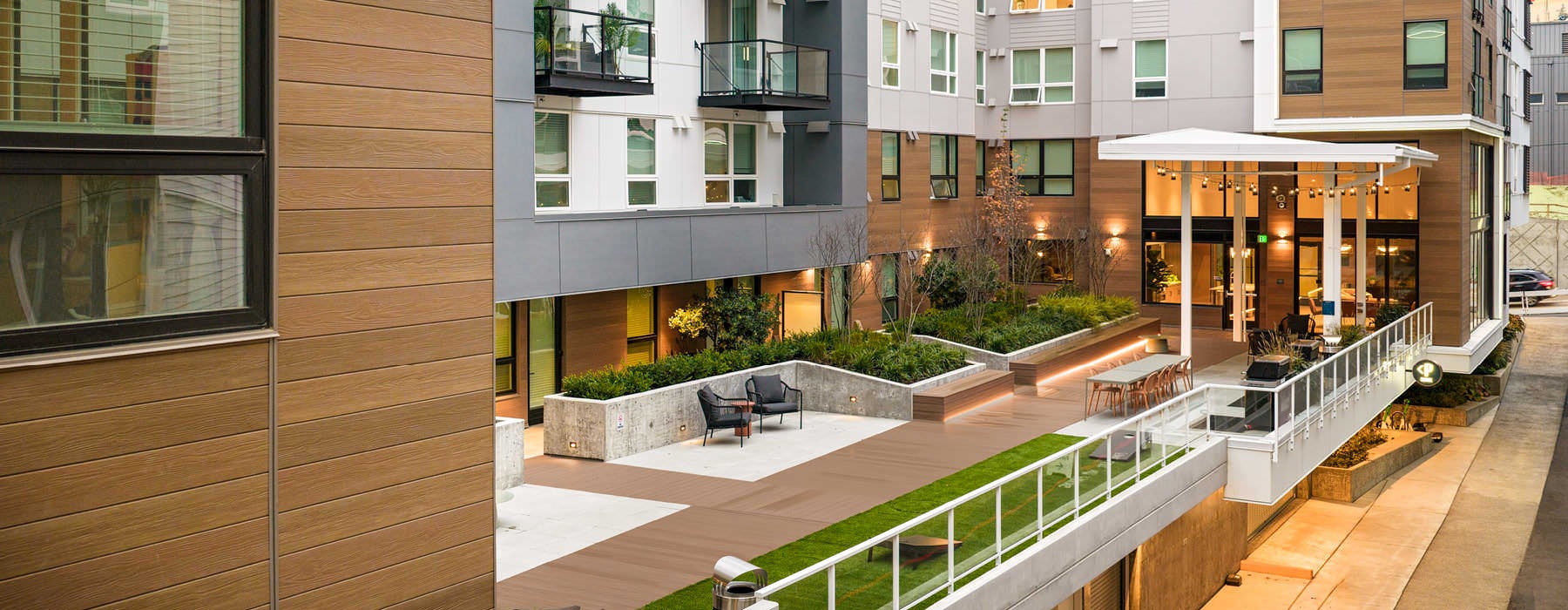 second floor balcony with grills and game lawn